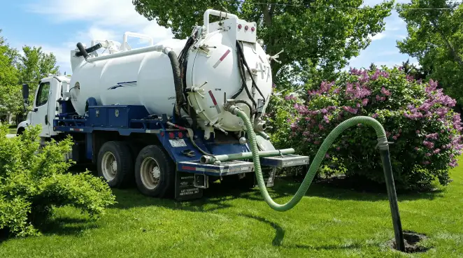 Professional vacuum truck performing residential drainage and septic maintenance in Glendale, AZ