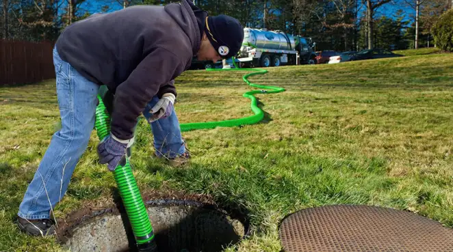 Service technician performing residential septic pumping and drainage maintenance in Glendale, AZ